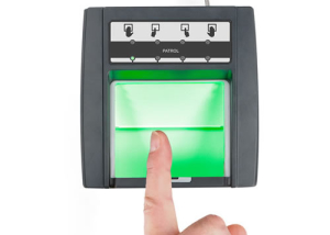 A person is touching the green screen of their fingerprint.